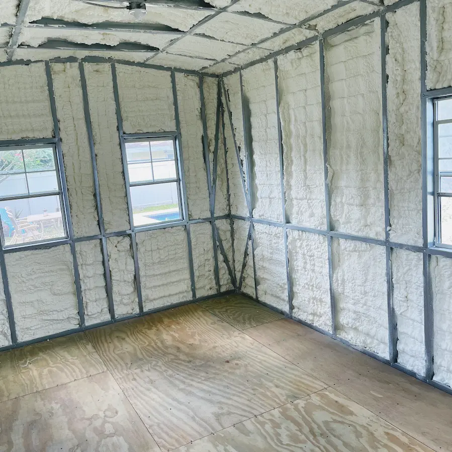 Closed-cell spray foam insulation applied to wall cavities in a residential project in East Brunswick